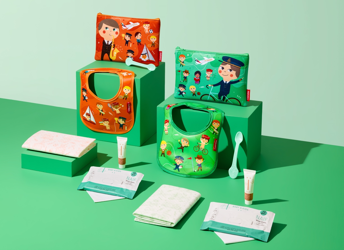 a group of baby items on a green surface